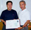Shi Gong being presented with his Qi Gong certificate at the China Academy of Traditional Chinese Medicine 2006